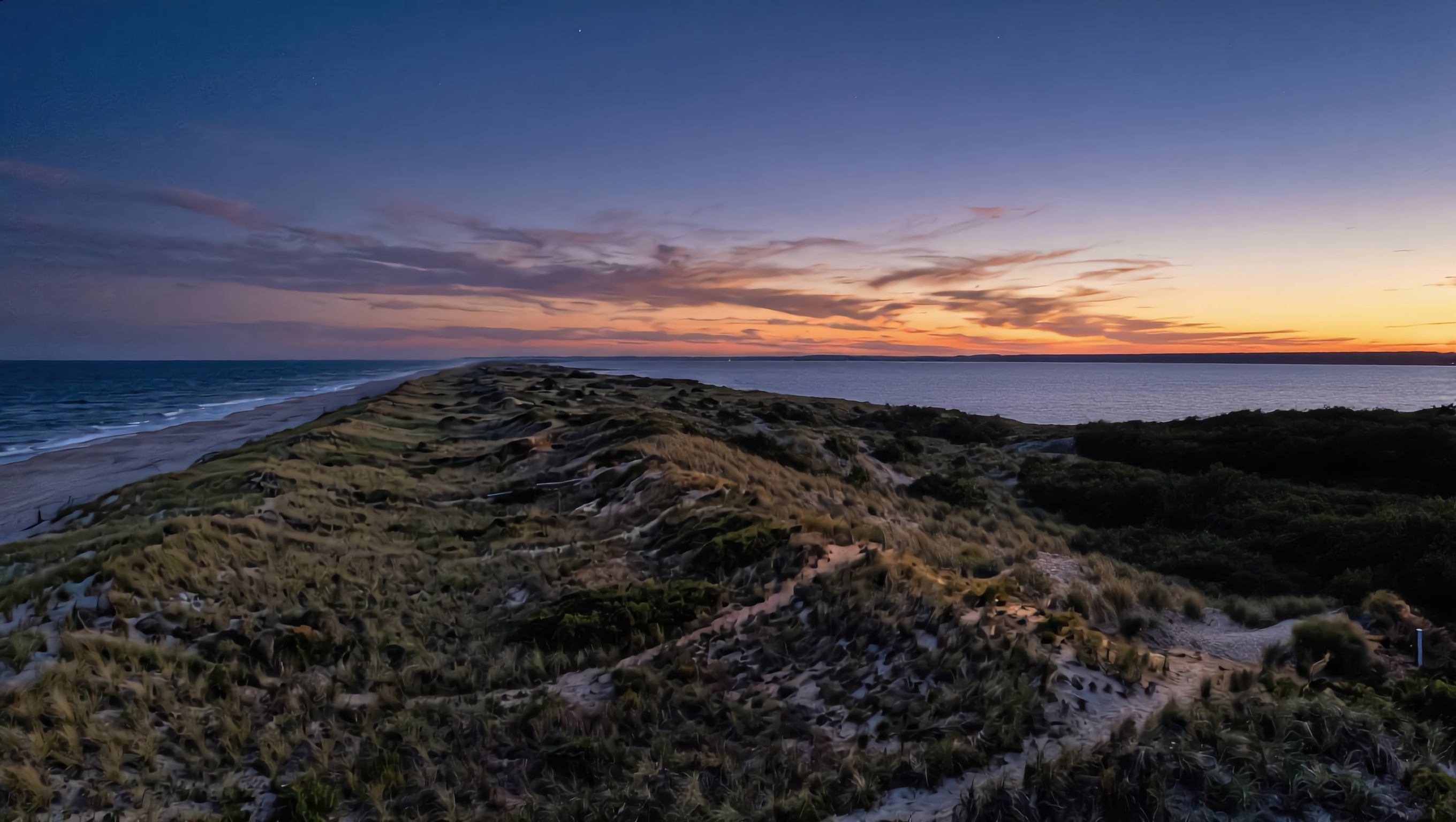 An empty dune ridge at dusk
